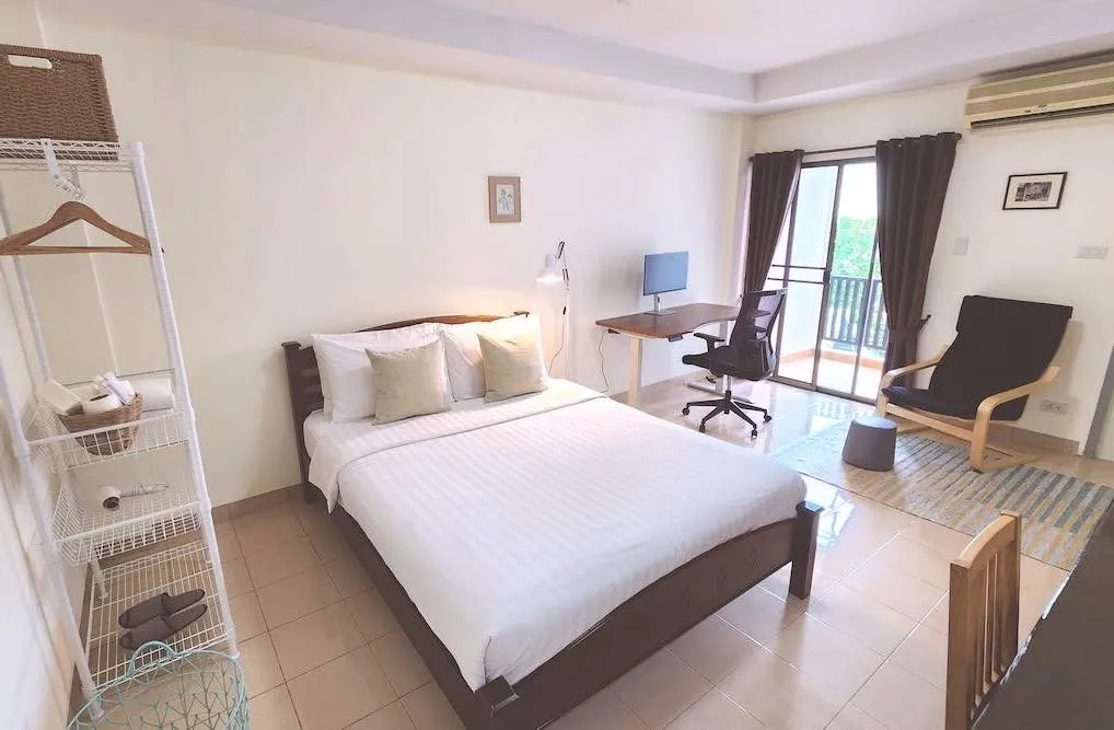 The Digital Nomad room with electric standing desk and 4K display