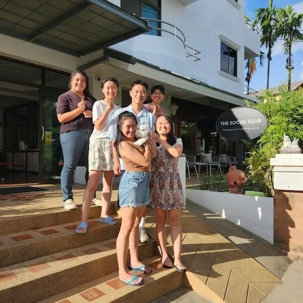 Coliving members standing on the stairs