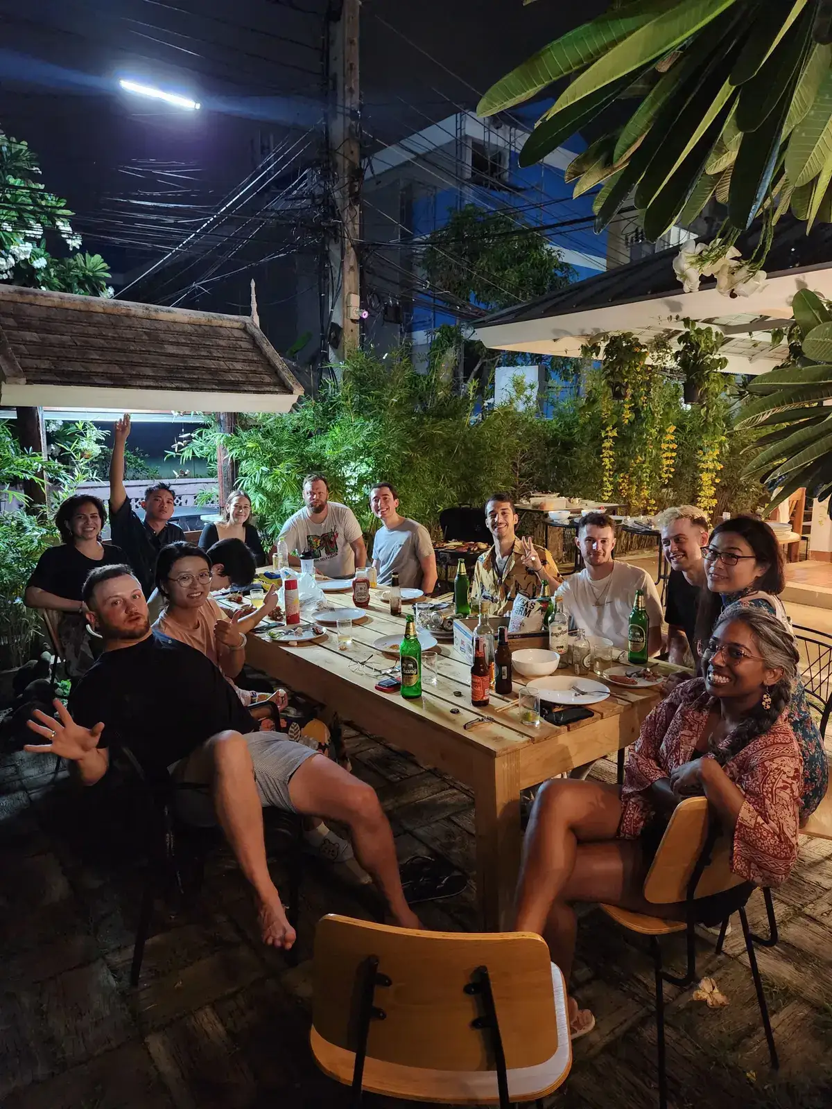 Members sharing a family dinner in the garden