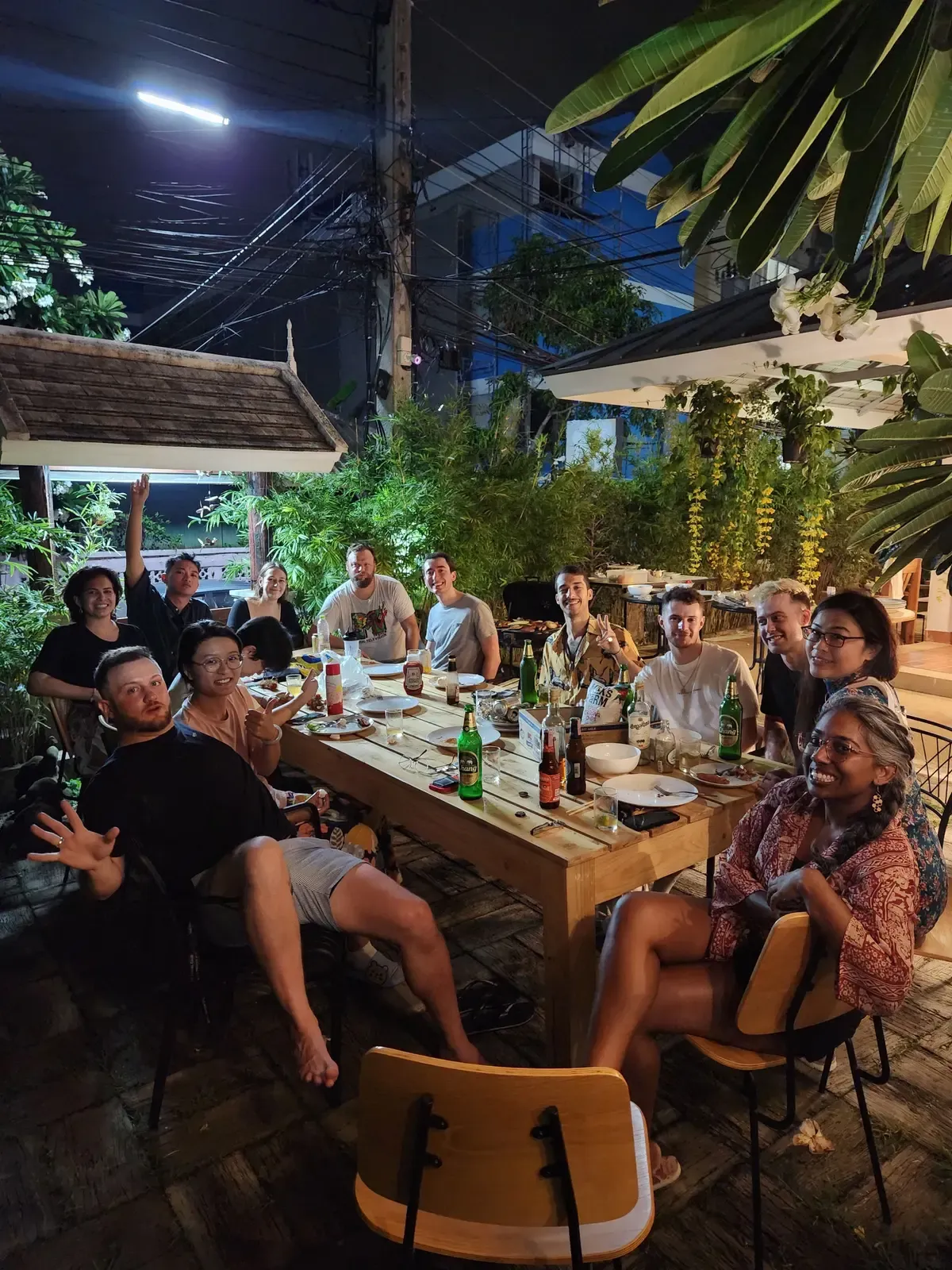 Members sharing a family dinner in the garden